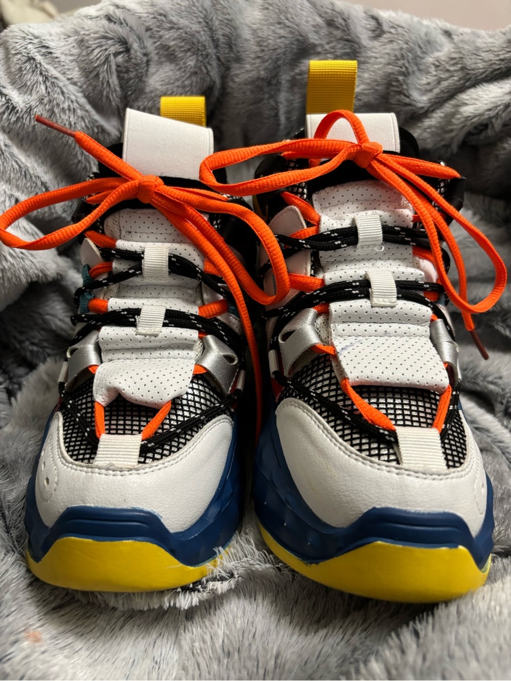 Youth White Sneakers with Blue & Yellow Soles and Orange Laces